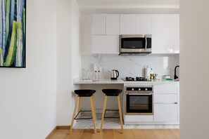 Microwave, stovetop, coffee/tea maker, cookware/dishes/utensils