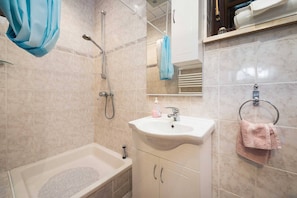 Shower, hair dryer, towels, toilet paper