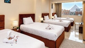 Family Quadruple Room, Desert View | Living area | 32-inch TV with digital channels - Experieance Pyramids VIEW (Giza)
