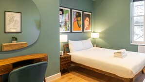 A bedroom with a bed, bedside tables, a desk, and a chair. There are framed artworks on the wall. - Host Stay The Georgian Quarter at Catharine House III (Liverpool)