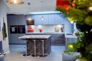 Fridge, microwave, oven, stovetop - Devon Cottage is a stylish centrally-located three bedroom house with private parking. (Whitstable)