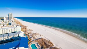 A beachfront hotel with a pool, beach access, and ocean views. - Phoenix Gulf Towers 1708 4 Bedroom Condo (Orange Beach)
