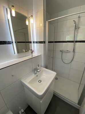 Shower, hair dryer, towels, soap