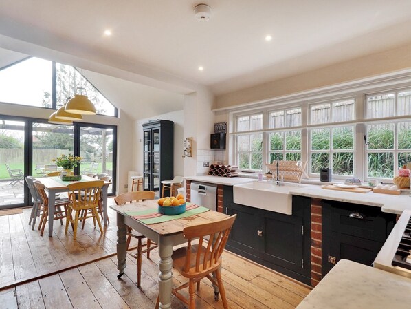 Fridge, dishwasher, coffee/tea maker, cookware/dishes/utensils