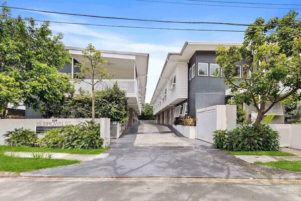 A modern apartment building with a central courtyard.