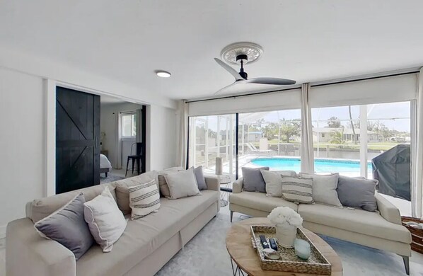 Living area - Sailors Paradise-Waterfront Gulf & Sailboat access with AC, WIFI, heated Pool! (North Fort Myers)