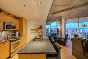 Fridge, stovetop, dishwasher, coffee/tea maker