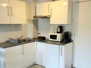 Fridge, microwave, stovetop, coffee/tea maker