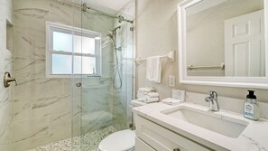 Shower, hair dryer, towels, soap