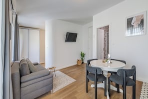 Deluxe Apartment, Balcony | Living area | 100-cm TV with cable channels - Finn Luxury Rooms (Split)