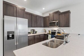 Fridge, microwave, oven, stovetop - New 4BR/4.5BA Luxury Home • Ensuite Baths • EV Charger • Near U of A (Fayetteville)