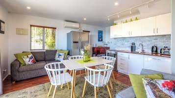 Premium Villa | Living area | 32-inch Smart TV with digital channels, streaming services