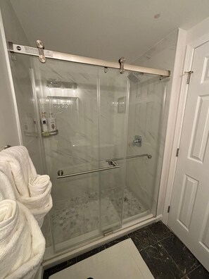 Shower, hair dryer, towels, soap