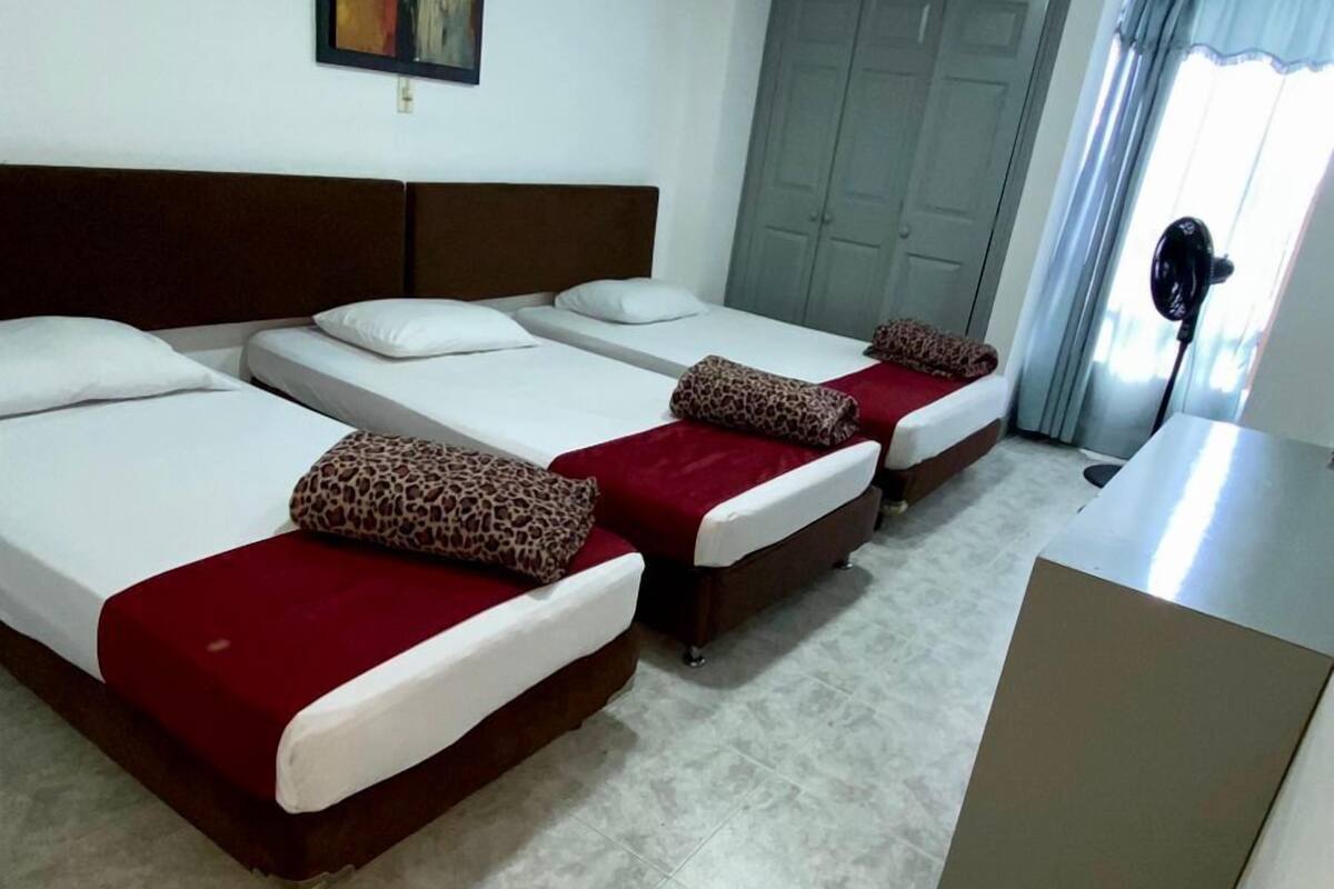Senior Quadruple Room, 2 Double Beds | Blackout curtains, iron/ironing board (on request), free WiFi