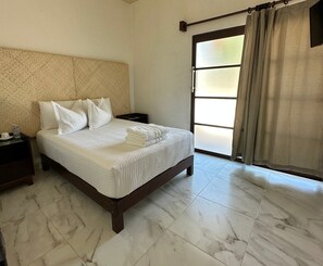 Standard Room | Individually furnished, blackout drapes, iron/ironing board, free WiFi