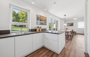 Fridge, stovetop, dishwasher, coffee/tea maker