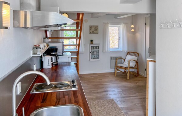 Fridge, stovetop, dishwasher, coffee/tea maker