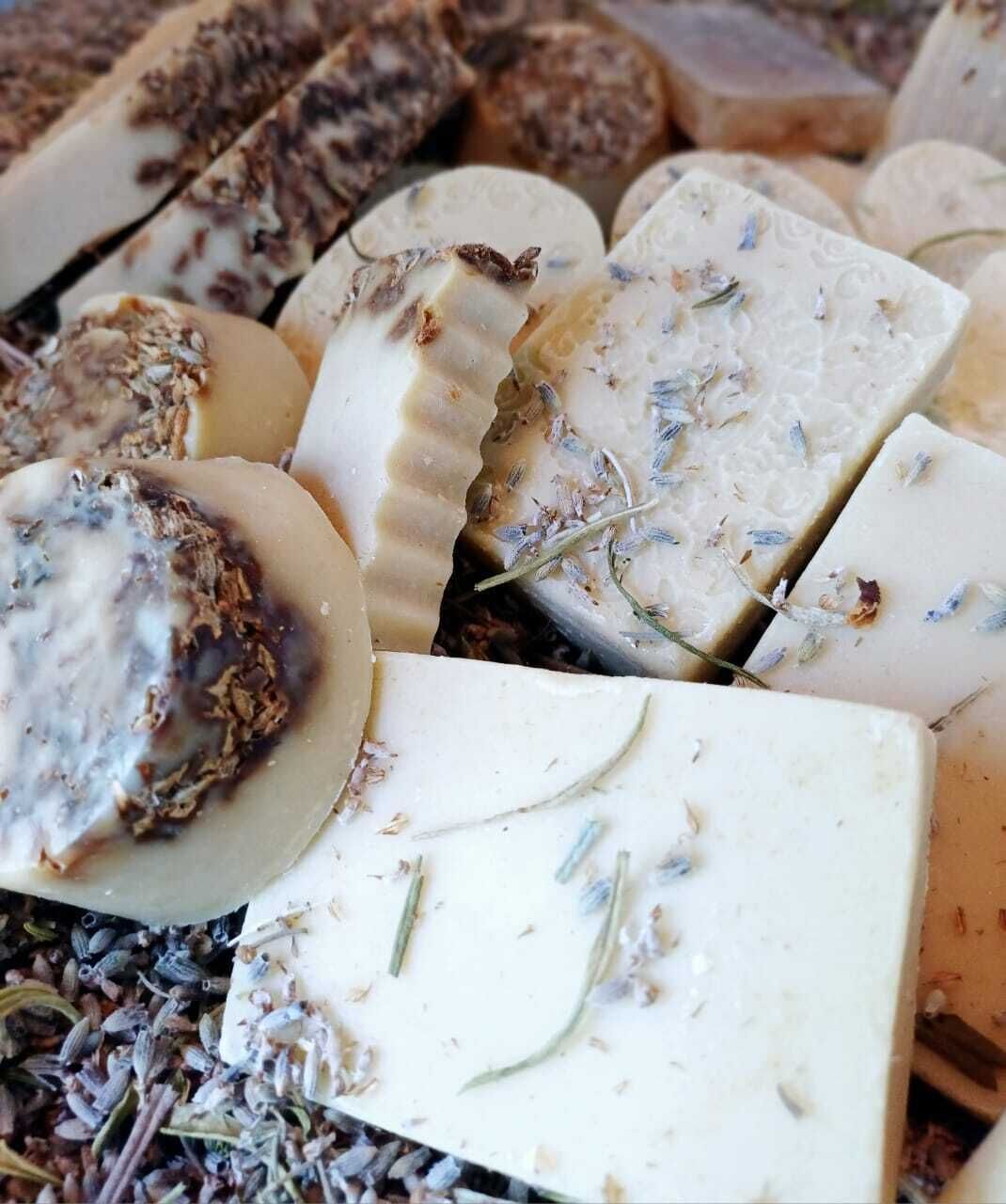 A variety of cheeses with herbs and possibly dried fruits.