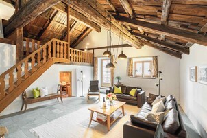 Executive Penthouse | Living area | 43-inch Smart TV with satellite channels