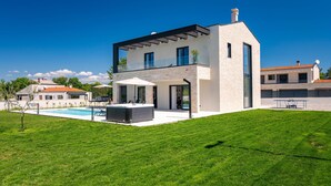 A modern two-story house with a swimming pool, a covered patio, and a well-maintained lawn. - Amazing home in Nedescina (Nedescina)