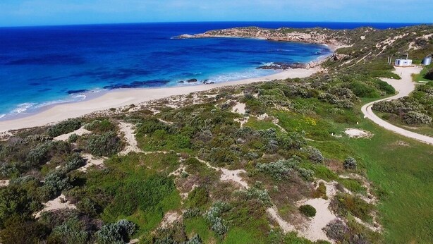A coastal landscape with a beach, paths, and sparse vegetation. - Hilltop Ocean View Pod (Marion Bay)