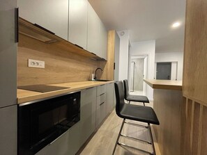 Fridge, microwave, stovetop, coffee/tea maker