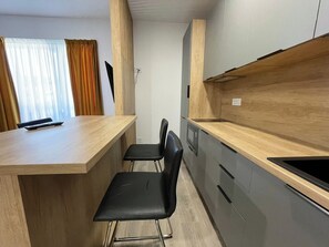 Fridge, microwave, stovetop, coffee/tea maker