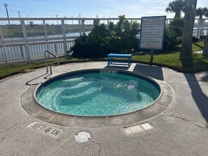 Outdoor pool, a heated pool - Downstairs 2-Bdrm, 2 bath - washer & dryer, patio, walking distance to beach (Corpus Christi)