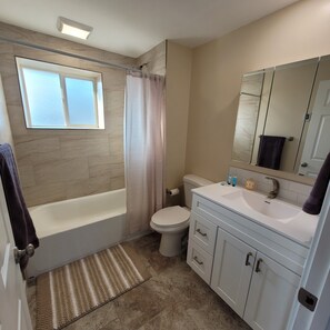 Shower, towels, soap, toilet paper