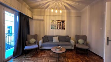 Apartment, City View | Living area | 40-inch flat-screen TV with digital channels