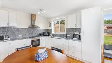 Coffee/tea maker, fridge, microwave, oven