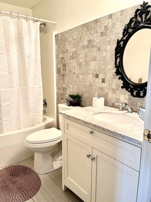 Hair dryer, towels, soap, toilet paper