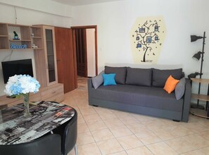 Apartment (Two Bedroom Apartment with Terrace) | Living room | 32-inch flat-screen TV with cable channels