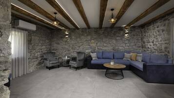 Villa (Three Bedroom Villa) | Living room | 32-inch flat-screen TV with cable channels