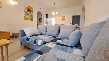 Apartment (Two Bedroom Apartment with Terrace) | Living room | 32-inch flat-screen TV with cable channels