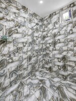 Shower, hair dryer, slippers, towels