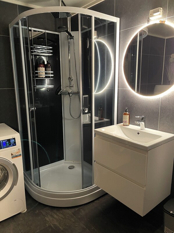 Shower, hair dryer, towels, soap