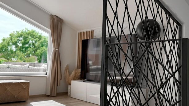 A modern living room with a large window, a sofa, a TV, and a decorative partition. - Premium Apartment Seaview (Porec)