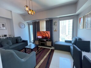 Luxury Condo, 1 Queen Bed, Balcony, Ocean View | Living area | Flat-screen TV