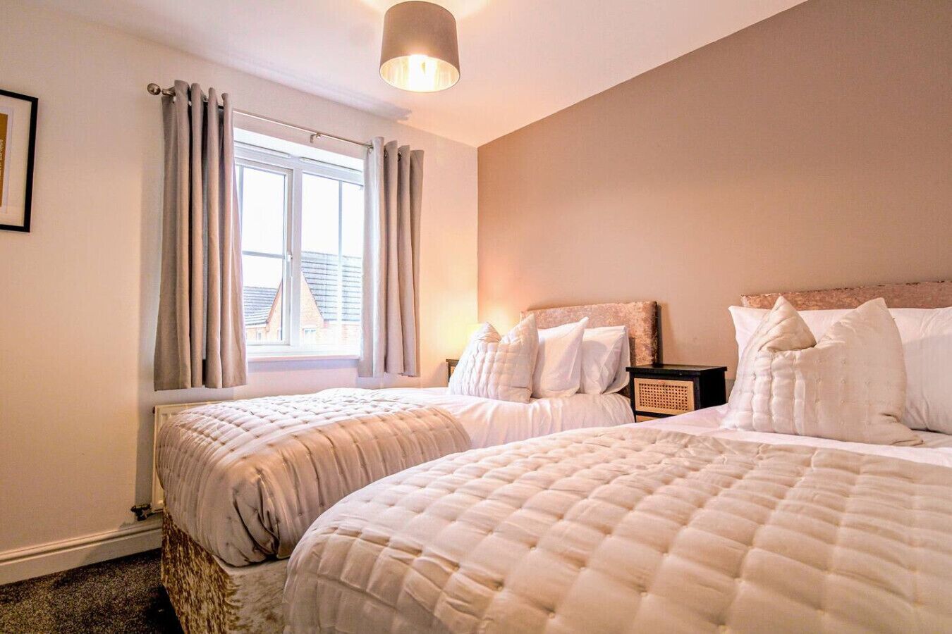 Bedroom 1 with a comfortable zip link bed which is configured as two single beds by default or can be zipped together to form a king-size bed upon request. Fresh linen and towels are provided.