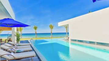 Exclusive Villa, 5 Bedrooms, Beach View, Beachfront | Living area | Flat-screen TV