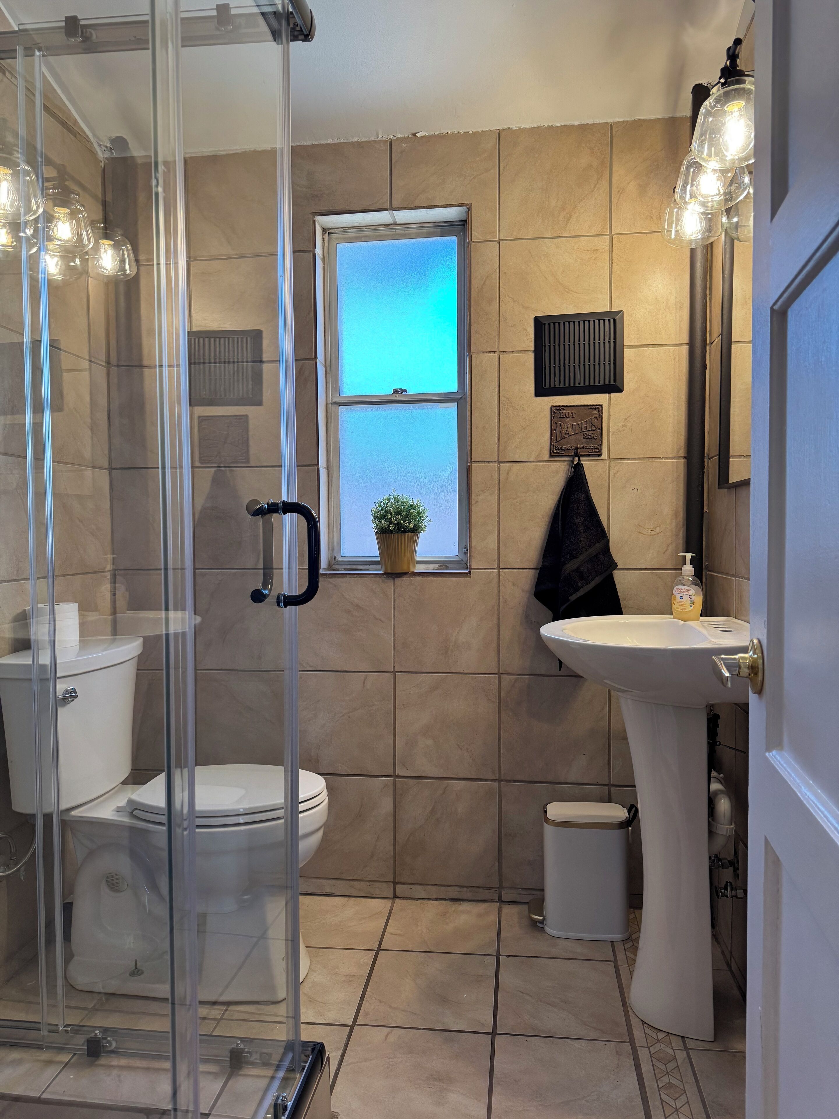 Shower, hair dryer, towels, soap