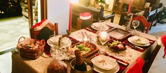 House in the mountains with pool and river.