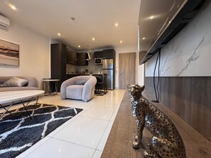 Luxury Apartment, City View | Living area | 55-inch Smart TV with digital channels