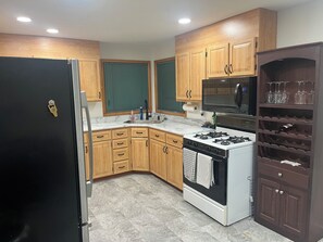 Fridge, microwave, oven, stovetop - Rally Rental: 4-bedroom house - walking distance from Sturgis Main Street. (Sturgis)