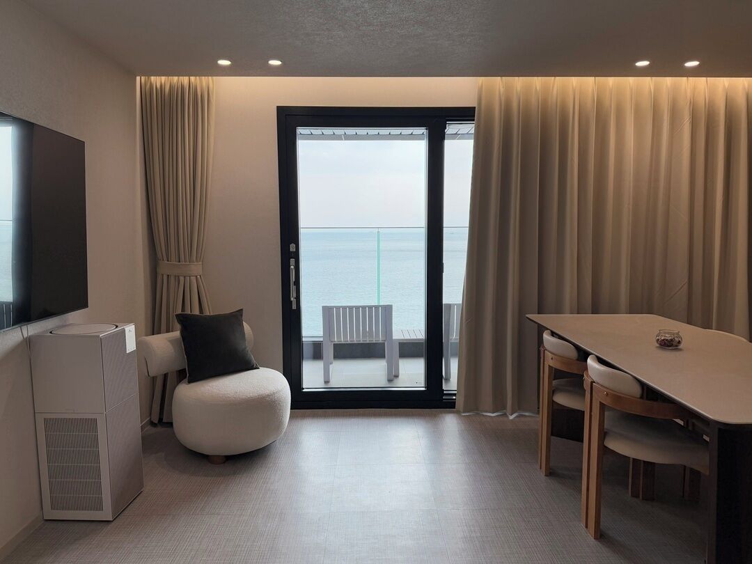 Penthouse, Balcony, Sea View | Living area | 65-inch Smart TV with cable channels, Netflix, streaming services