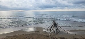 On the beach, sun-loungers, beach towels