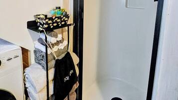 Shower, hair dryer, towels, soap