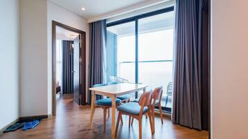 Premium Suite, 2 Bedrooms, Balcony, Sea View | Living room | 65-inch LED TV with satellite channels, computer monitors