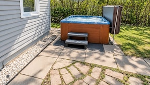 Outdoor spa tub - The Fern | Hot Tub • Arcade • Games • Playground (Calgary)